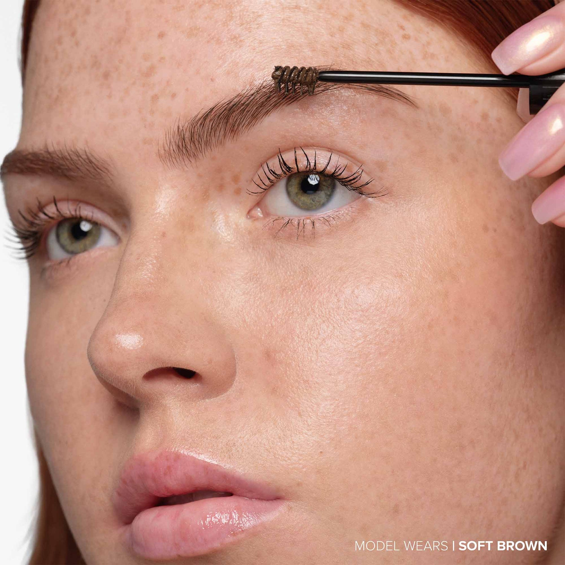 Soft Brown| Deluxe Mini Volumizing Tinted Brow Gel -Model Using Product Wand